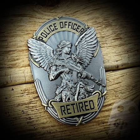 St. Michael "Police Officer — Retired" badge, representing LEOSA / HR218 requalification for retired and separated officers