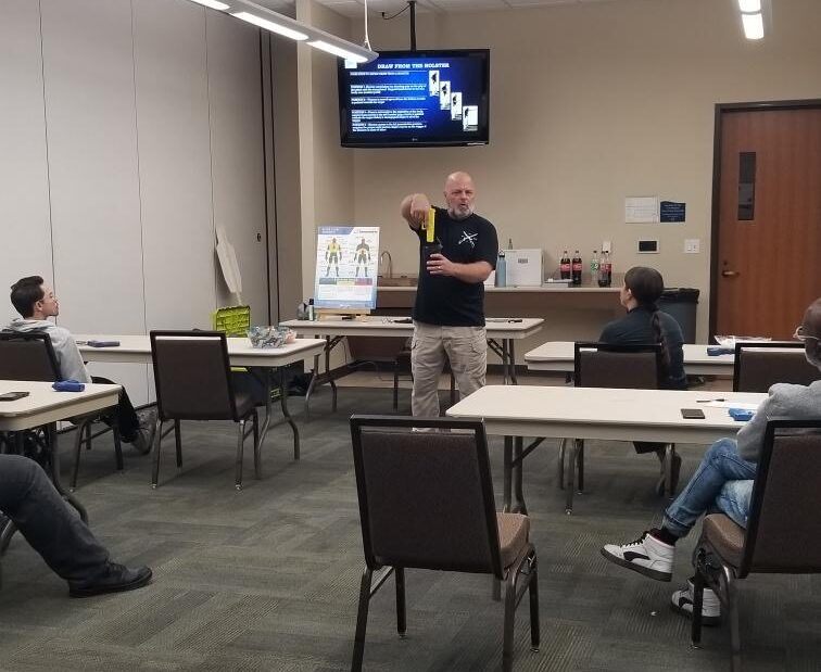 Frank Tooker teaching defensive tactics in a Security Level 3 classroom